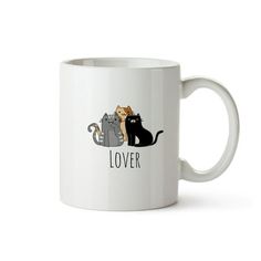 a white coffee mug with two cats and the words lover written in black on it