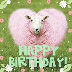 a sheep is standing in the grass with flowers around it's head, and says happy birthday