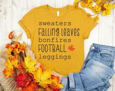 a t - shirt that says sweaters falling leaves bonfires football leggings