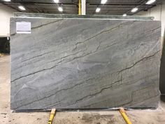 a large gray marble slab in a warehouse