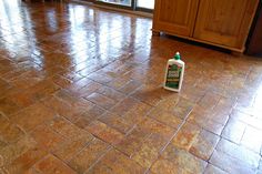 a bottle of cleaner sitting on the floor