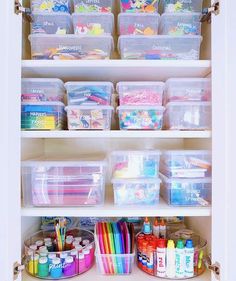 an organized closet filled with lots of crafting supplies and storage bins on top of shelves