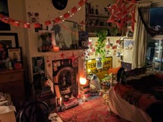 a living room filled with lots of clutter and decorations on the wall above a fire place