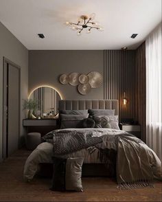 a bedroom with a large bed and two mirrors on the wall