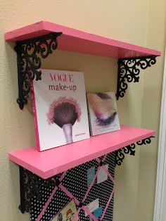 a pink shelf with some pictures on it