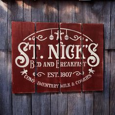 a wooden sign that says st nick's bed and breakfast