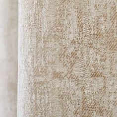 closeup of an upholstered fabric textured with white and brown colors,