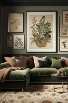 a living room with green couches and pictures on the wall above them in various colors