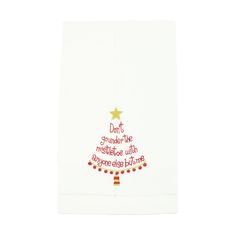 a white towel with a christmas tree on it