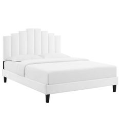 a white bed with black legs and headboard is shown in front of a white background