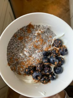 a bowl filled with blueberries and yogurt