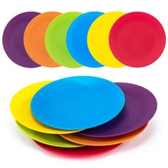 colorful plates stacked on top of each other in different colors and sizes, with one empty plate