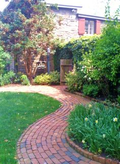 a brick path in front of a house