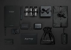 an assortment of items are displayed on a black surface with the words, logo and brand name