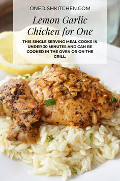 lemon garlic chicken for one is served over rice and garnished with parsley