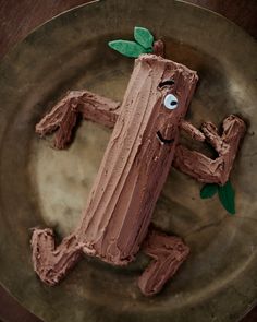 a chocolate cake shaped like a lizard on a plate