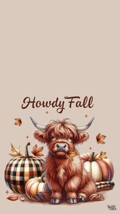 a brown cow sitting next to some pumpkins and other autumn decorations on a beige background