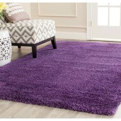 a purple area rug in a living room