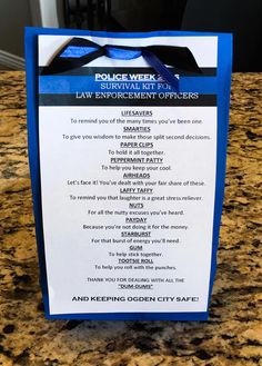 a police week survival kit for law enforcement officers sits on a granite countertop in front of a door