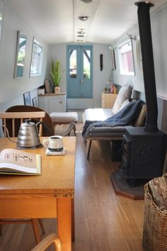 a living room filled with furniture and a wood stove