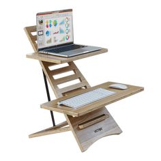 a laptop computer sitting on top of a wooden stand