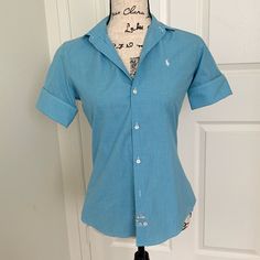 Ralph Lauren Blue Plaid Button-Up Shirt. Top Has 3/4 Quarter Cuffed Sleeves With Horse Logo On Upper Chest. Comes With Extra Buttons. Size 4 (Small). Brand New. Blue Half Sleeve Blouse With Buttons, Blue Half Sleeve Shirt For Workwear, Fitted Half Sleeve Shirt With Button Closure, Blue Half Sleeve Workwear Shirt, Blue Fitted Half-sleeve Blouse, Blue Half Sleeve Blouse With Button Closure, Ralph Lauren Blue Tops With Button Closure, Blue Ralph Lauren Tops With Button Closure, Ralph Lauren Blue Top With Buttons