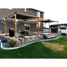 a house with a covered patio in the front yard