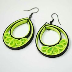 pair of neon green and black earrings on white background