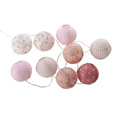 pink and white paper lanterns are hanging from strings on a white background, with one string in the shape of a ball