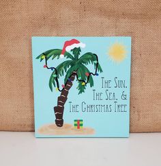 a christmas card with a palm tree and santa's hat on it