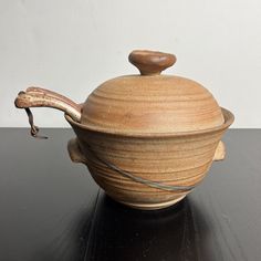 a wooden bowl sitting on top of a table