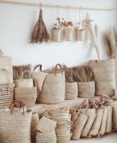 many baskets are lined up against the wall