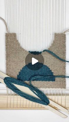 a video demonstrating how to make a weaving project with yarn and cotton on the loom