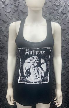 This is a black with white ink sleeveless long Anthrax tank top with racer back. This has a Anthrax image screen printed on the front. 60% cotton/ 40% polyester These are handmade screenprinted and slightly vary from the photo. Please feel free to email me any questions. Thanks for looking. Due to an influx of incorrect addresses if a package is returned, you must pay the shipping cost to resend the item to you. I do not do exchanges and I do not take returns unless the item is damaged. I thorou Stretch Tank Tops In Grunge Style, Alternative Style Cotton Tank Top For Concerts, Fitted Tank Top For Concerts, Black Sleeveless Top For Alternative Fashion, Black Alternative Style Vest For Streetwear, Alternative Cotton Tank Top For Concerts, Stretch Sleeveless Tank Top For Concerts, Fitted Alternative Style Tank Top For Festivals, Punk Style Tank Top For Concerts