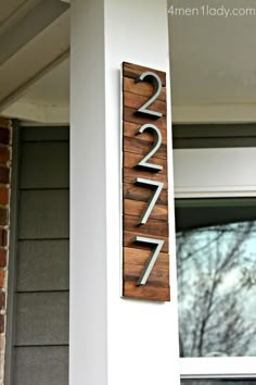 a house number sign on the side of a building