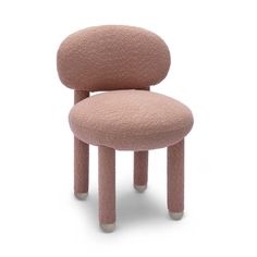 a pink chair that is on top of a white surface