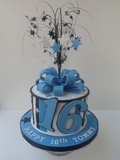 a blue and white birthday cake with stars on the top that says 16 th anniversary