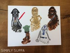 three handprints of star wars characters are displayed on a piece of white paper