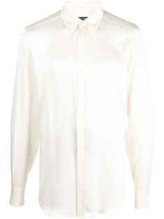 long-sleeved silk shirt from DOLCE & GABBANA featuring cream white, silk, classic collar, long sleeves, buttoned cuffs, curved hem and concealed front button fastening. Luxury Long Sleeve Shirt With Button Closure, Designer Long Sleeve Shirt With Button Closure, Luxury Long Sleeve Shirt, Designer Silk Collared Shirt, Designer White Shirt With Concealed Placket, Luxury Long Sleeve Satin Shirt, Designer Silk Shirt With Spread Collar, Designer Long Sleeve Dress Shirt For Work, Luxury Long Sleeve Dress Shirt With Button Closure