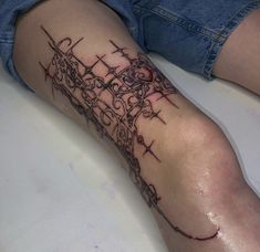 a person with a tattoo on their leg