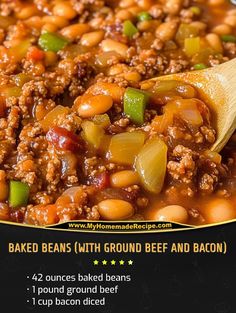 baked beans with ground beef and bacon in a skillet on top of a wooden spoon