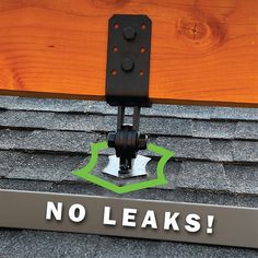 there is a sign that says no leaks on the top of a roof with an arrow pointing to it