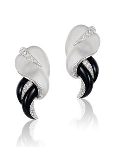 A leaf of white crystal gently wraps around an elegantly crafted black onyx stone to create our Galassia Onyx and Crystal Earrings. Small white diamonds finish off the piece for an added dash of sparkle. Specifications:1.7 Carat Diamond19.3 Gram 18 Karat GoldCrystal Onyx Gemstone Diamond Ring, 18k Gold Earrings, Onyx Jewelry, Black Onyx Stone, White Gold Bracelet, Onyx Earrings, White Gold Necklaces, Sapphire Bracelet, Ruby Earrings