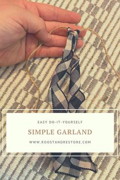 someone is tying a small scarf with twine on the floor and text overlay reads easy do - it - yourself simple garland