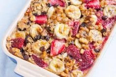 a pan filled with granola and sliced strawberries