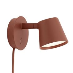 a brown wall lamp with a white light on it