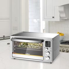 a toaster oven sitting on top of a kitchen counter