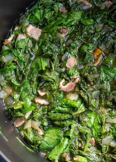 spinach, ham and onion soup in a crock pot ready to be cooked