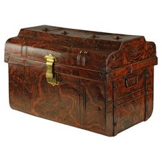 an antique wooden trunk with brass hardwares on the top and sides, isolated against a white background