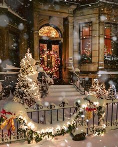 a snowy scene with christmas decorations and lights